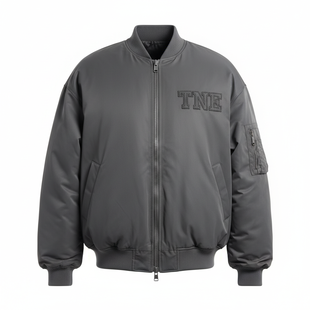 Charcoal gray oversized bomber jacket with dark gray TNE embroidered logo on ghost mannequin